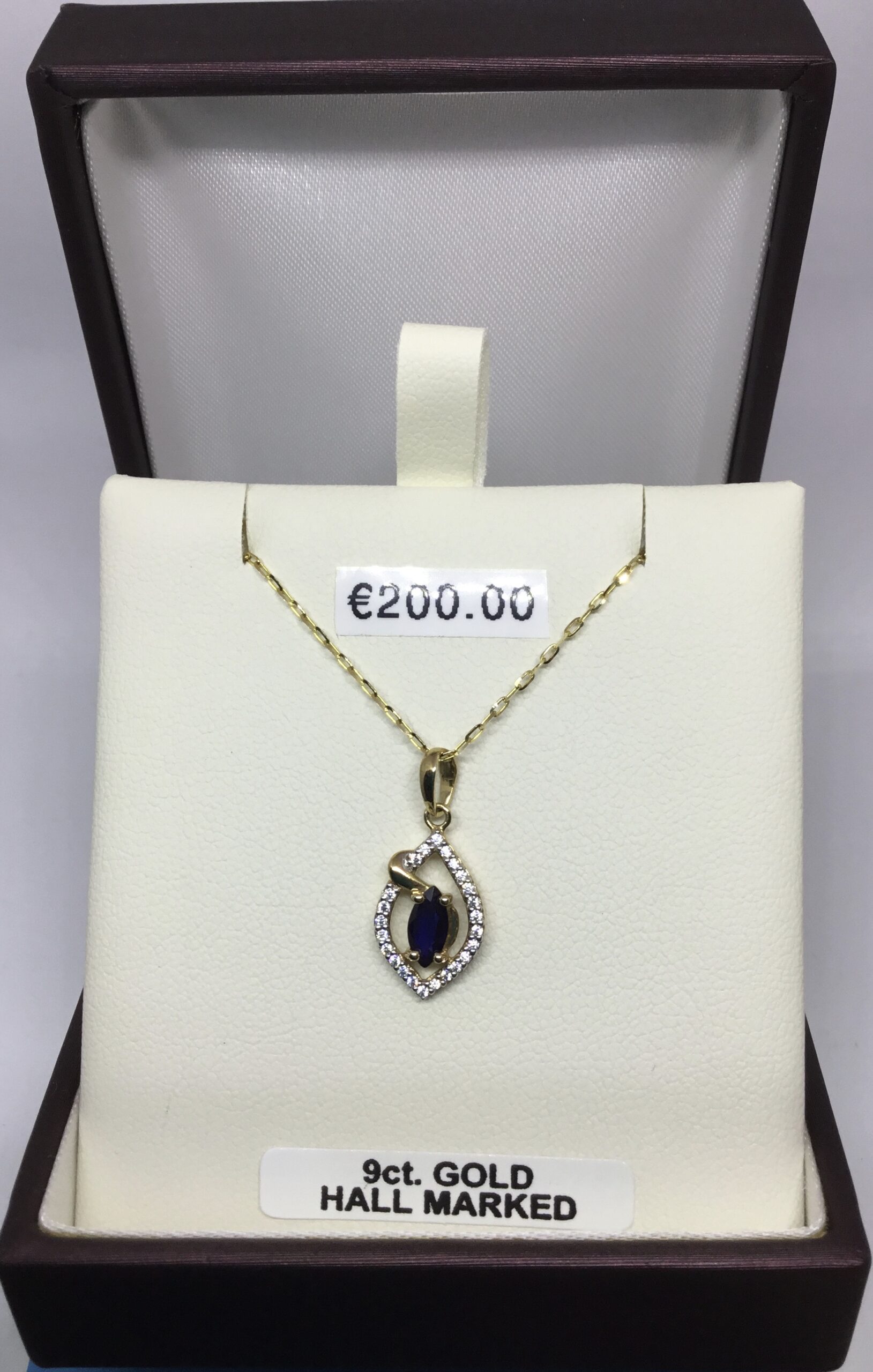 hen with sapphire pendant